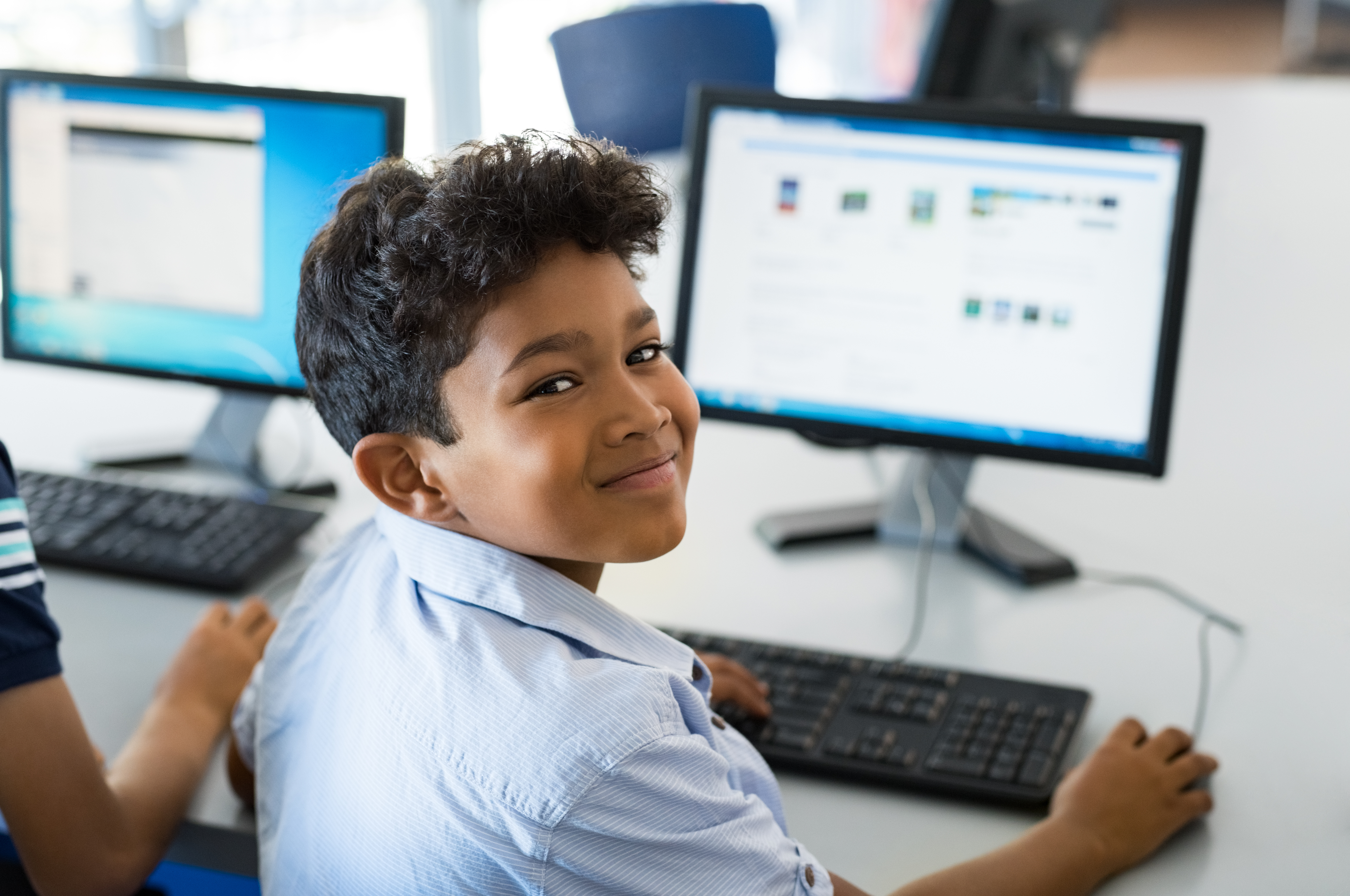 Boy doing coding on computer